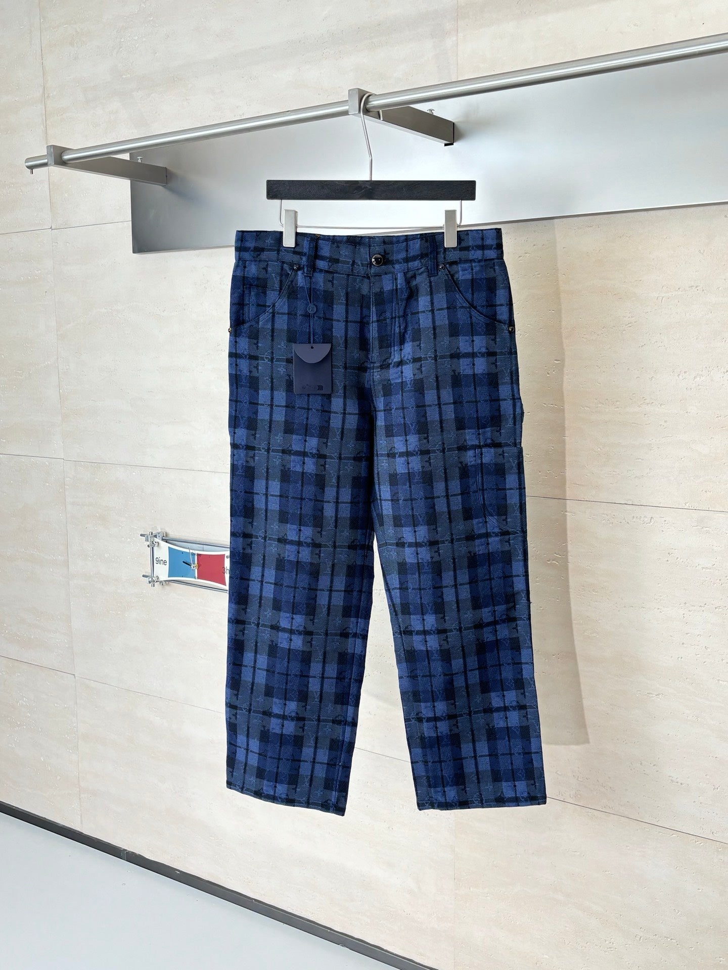 Louis Vuitton plaid pants, dark blue with black grid pattern, front button closure