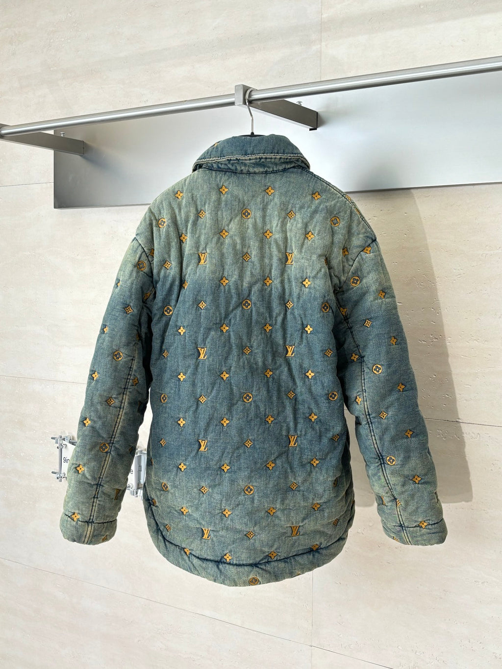 Louis Vuitton long denim jacket, back view with yellow monogram repeat pattern