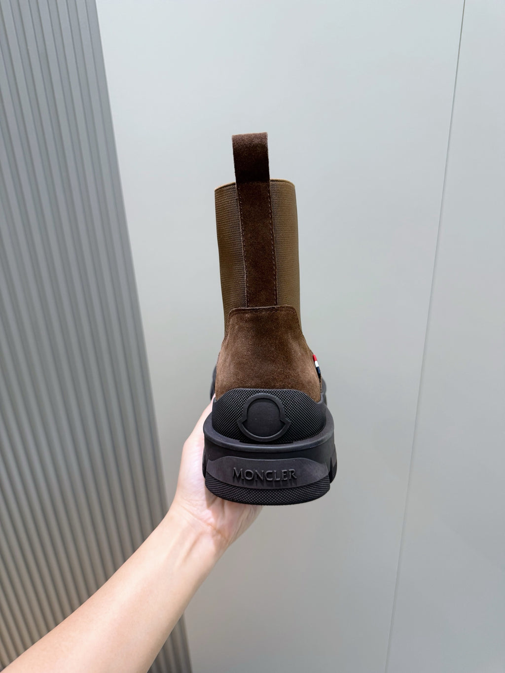 Moncler brown suede Chelsea boot heel view with branded sole and elastic gore