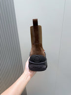 Moncler brown suede Chelsea boot heel view with branded sole and elastic gore