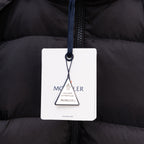 Moncler authenticity hang tag on black puffer jacket