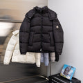 Moncler long puffer jacket with hood, front zipper, and buttoned pockets, black