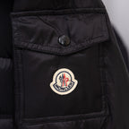 Moncler logo patch on black long puffer jacket chest