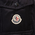 Moncler logo patch on black long puffer jacket chest