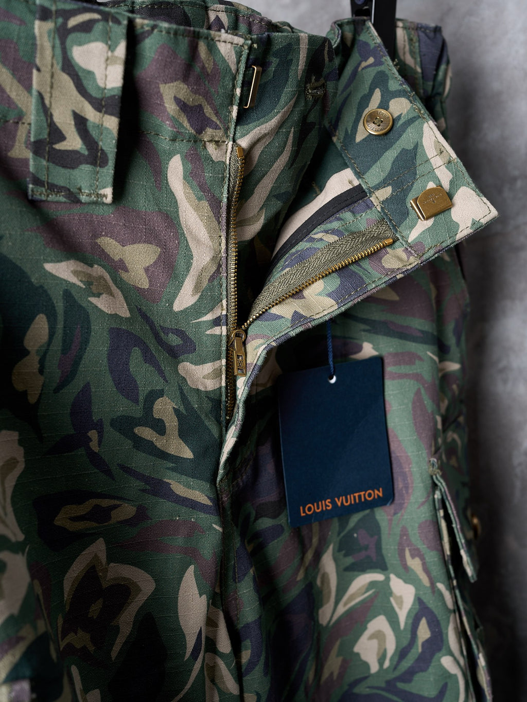 Louis Vuitton camouflage cargo pants detail with front zipper and snap pockets