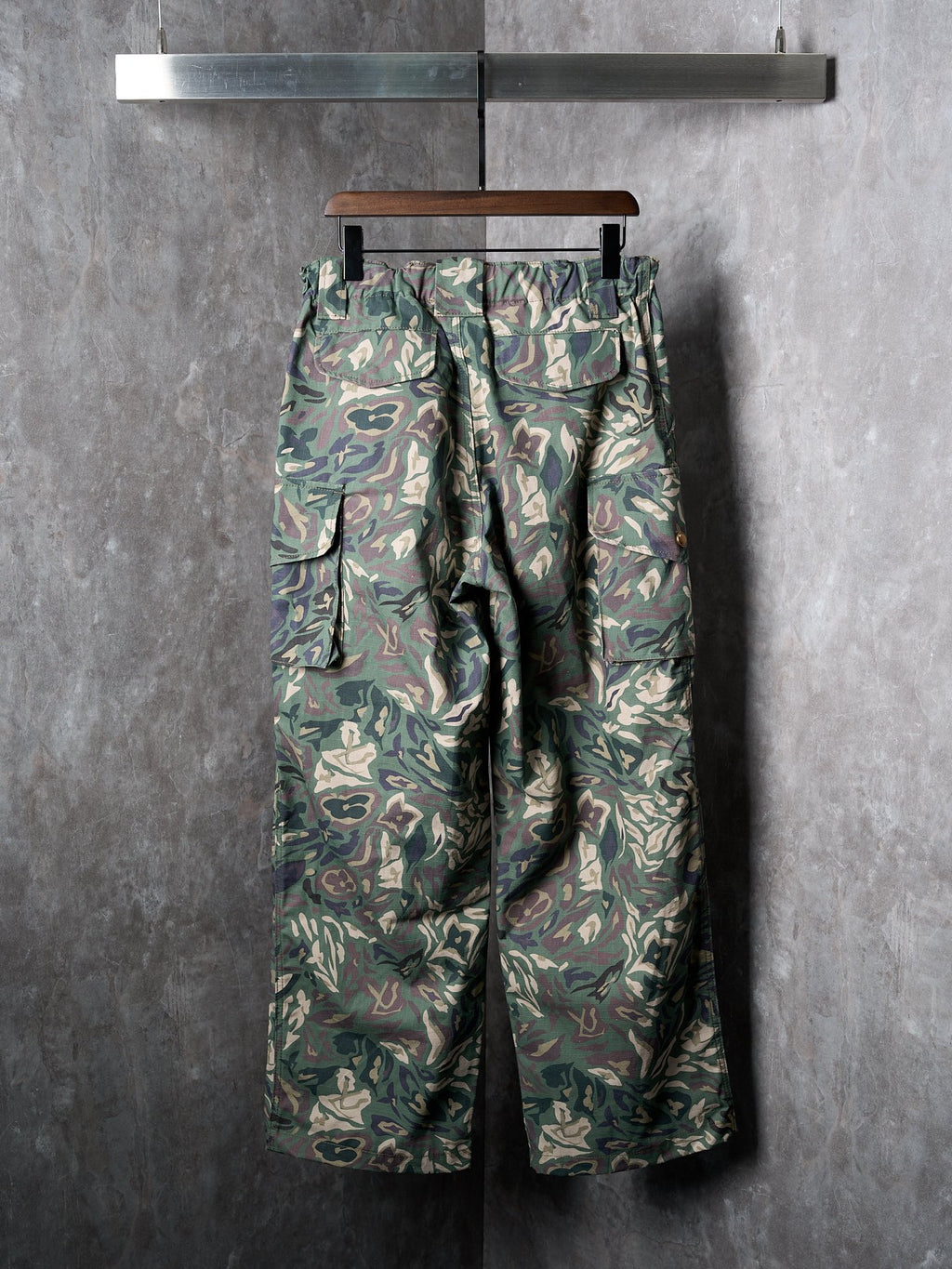 Louis Vuitton camouflage cargo pants on hanger with flap pockets and side seams