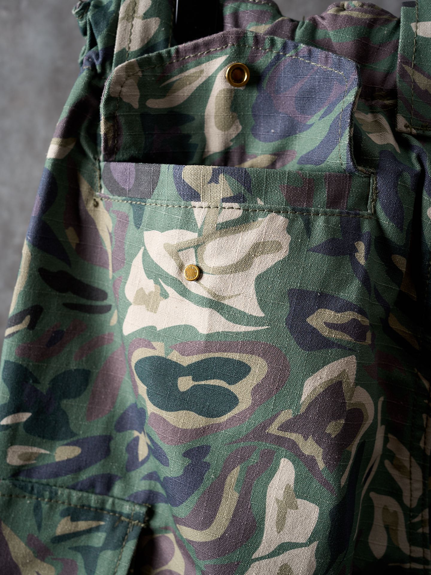 Louis Vuitton camouflage cargo pants front view close-up of waistband button