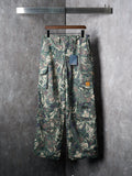 Louis Vuitton camouflage cargo pants on hanger with buttoned front and pockets