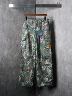 Louis Vuitton camouflage cargo pants on hanger with buttoned front and pockets