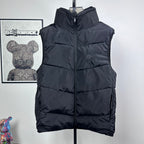 Moncler hooded puffer vest, sleeveless front view, dark quilted baffles and zip
