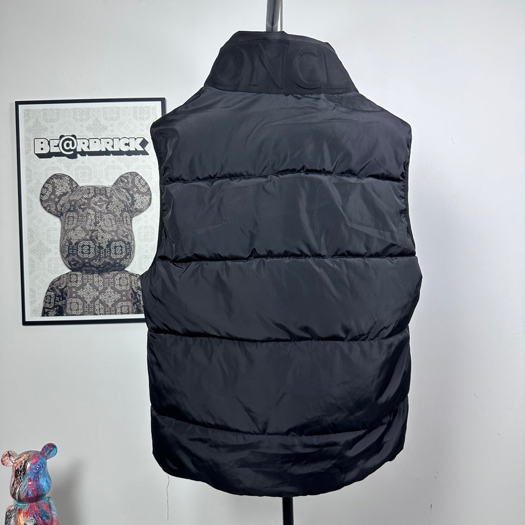 Moncler hooded puffer vest, back view, dark quilted baffles and adjustable hood
