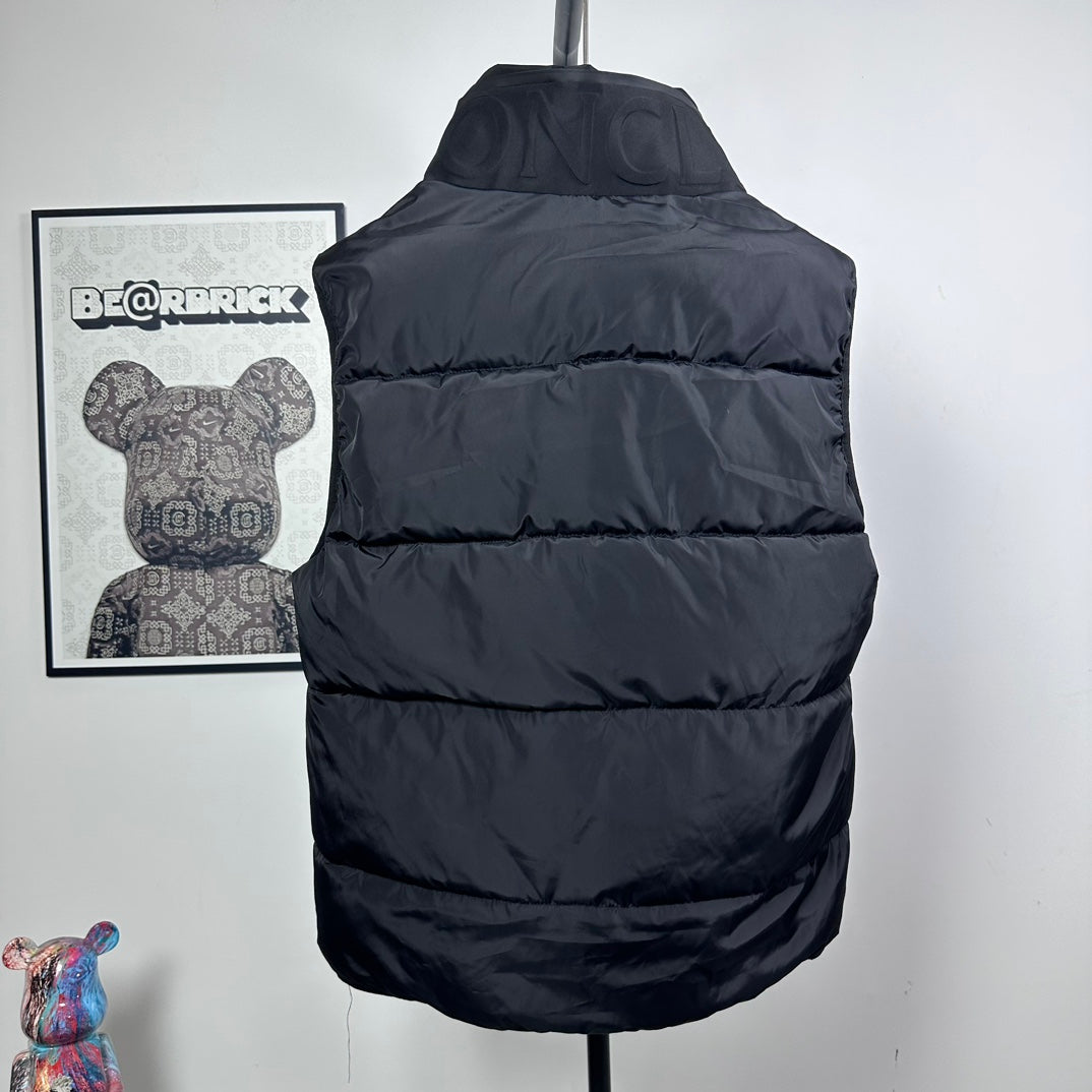 Moncler hooded puffer vest, back view, dark quilted baffles and adjustable hood