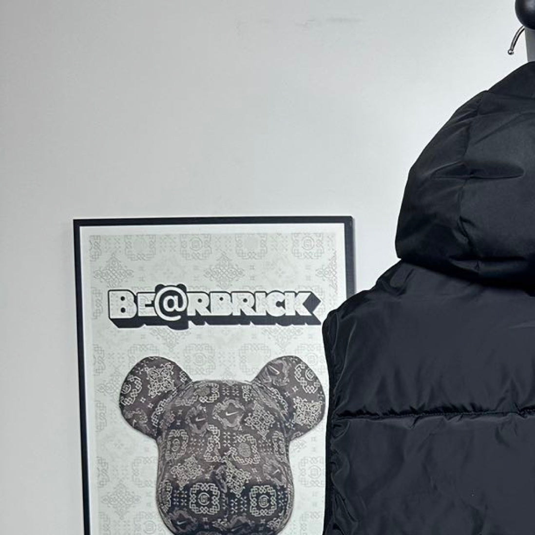 Moncler hooded puffer vest, back collar close-up, dark quilted baffles