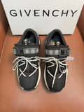 Luxury black knit sneakers with white soles, lace-up front, and logo strap details