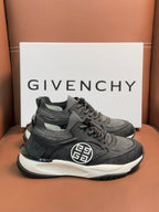 Dark gray lace-up sneakers with textured panels, front logo, and white midsole