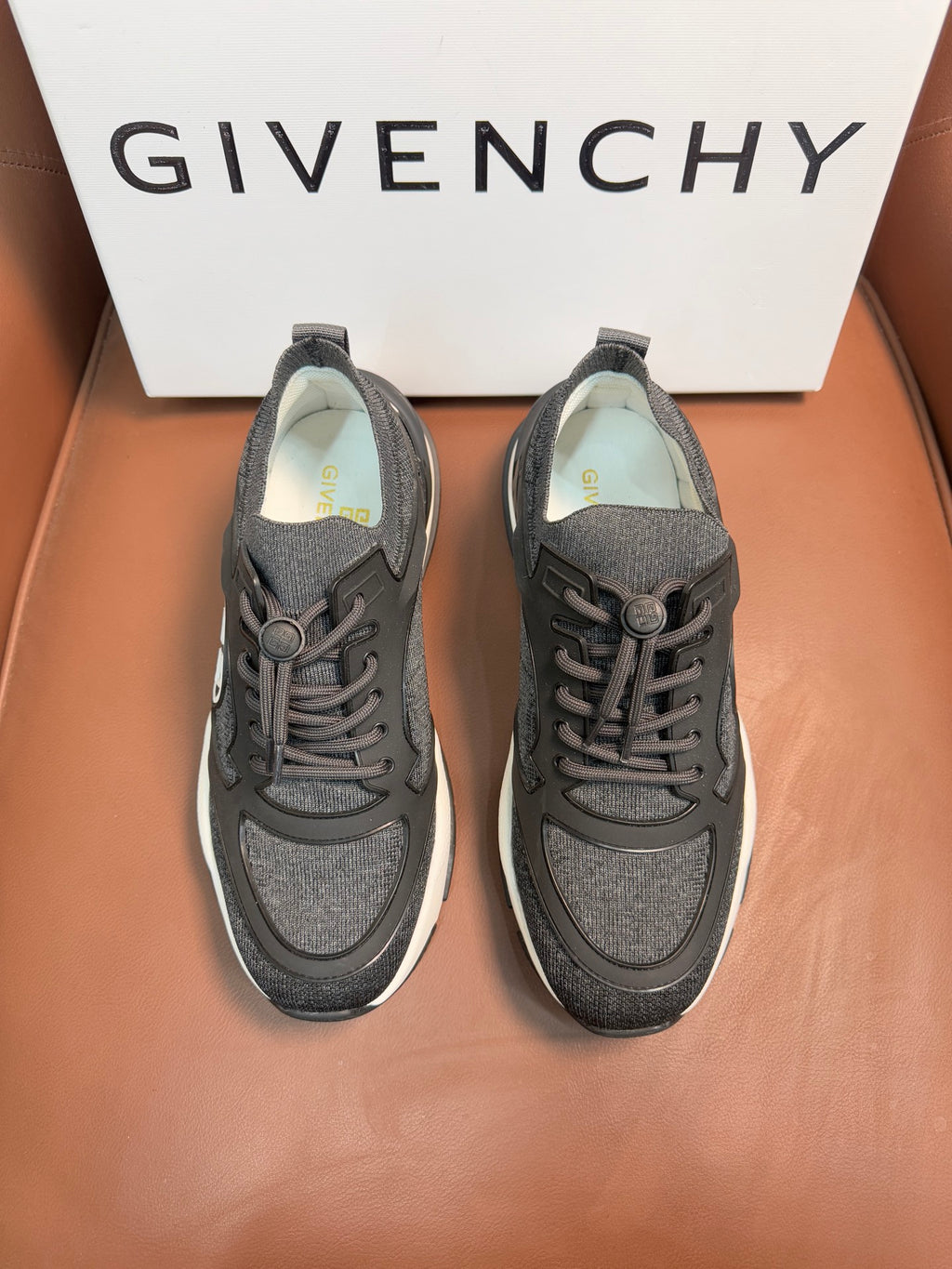 Givenchy dark gray lace-up sneakers with logo patch and white rubber sole