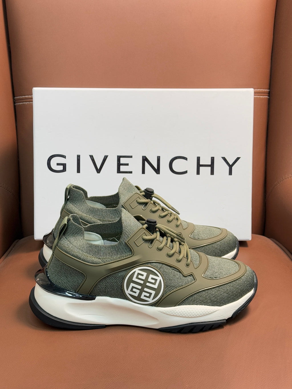 Givenchy sneakers in olive green with lace-up, side emblem, and white midsole