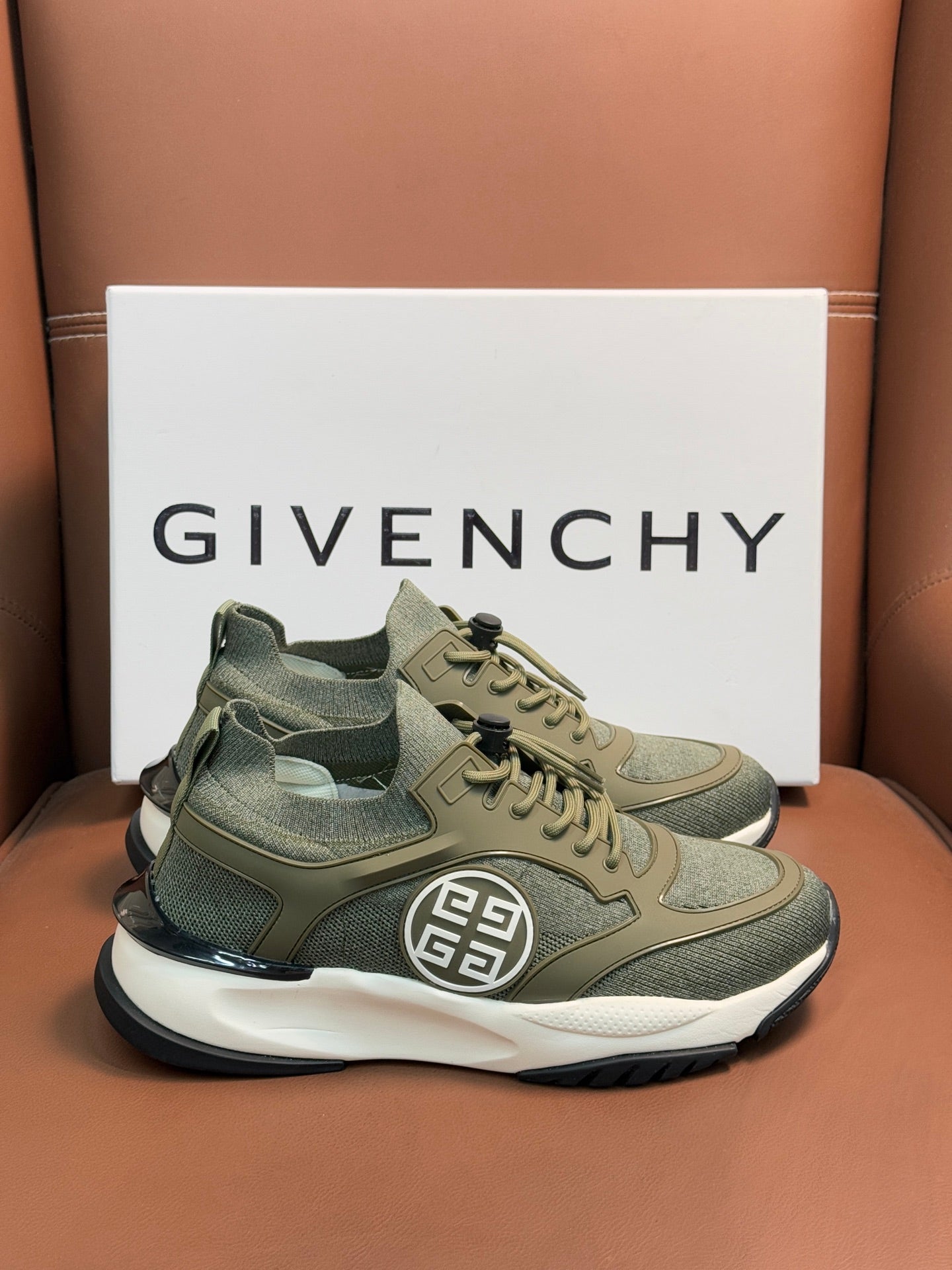 Givenchy sneakers in olive green with lace-up, side emblem, and white midsole
