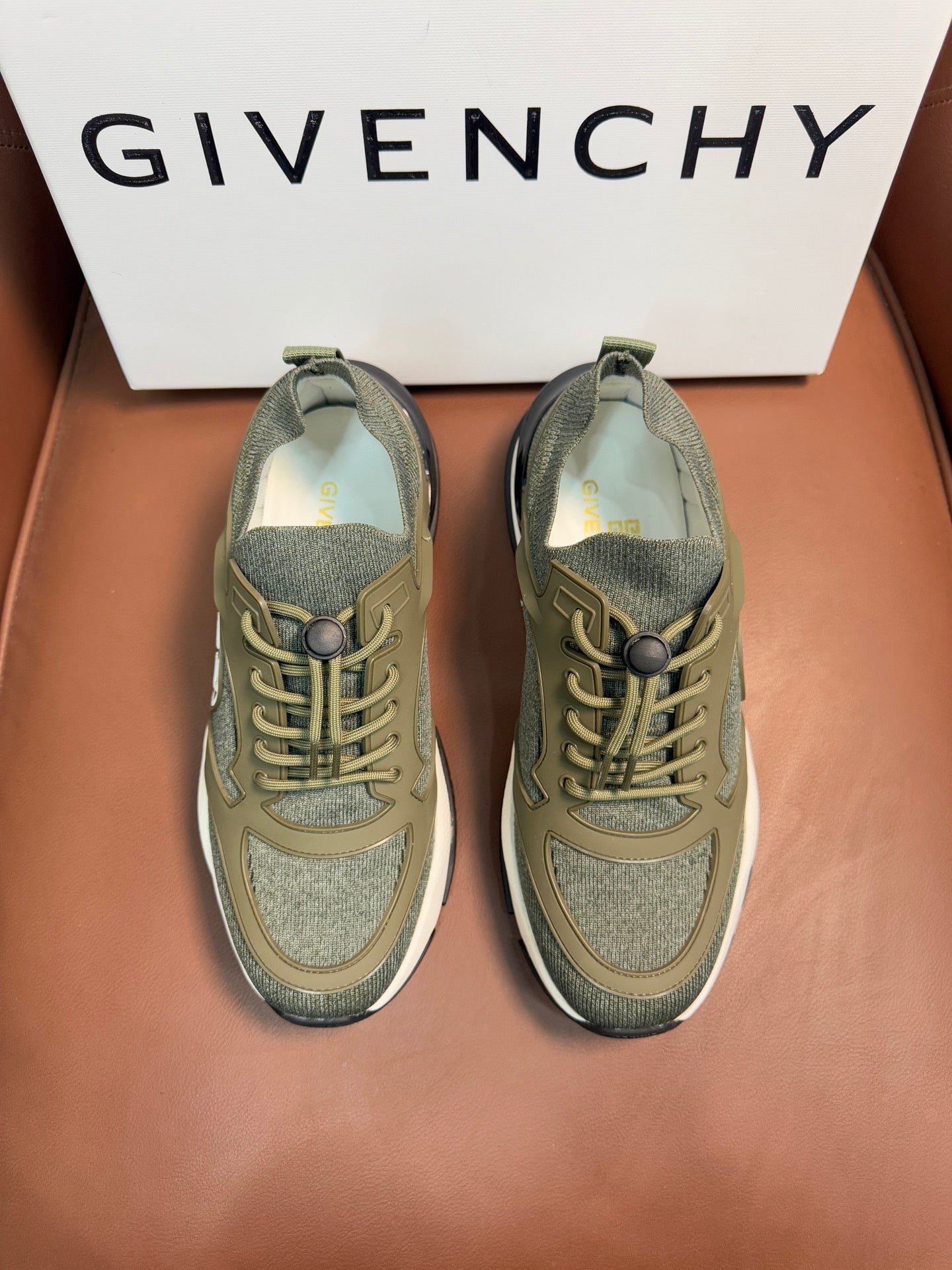 Givenchy luxury sneakers in olive green with lace-up front and contrast trim