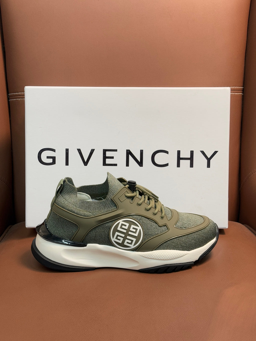 Givenchy lace-up sneakers in olive green with side emblem and thick sole