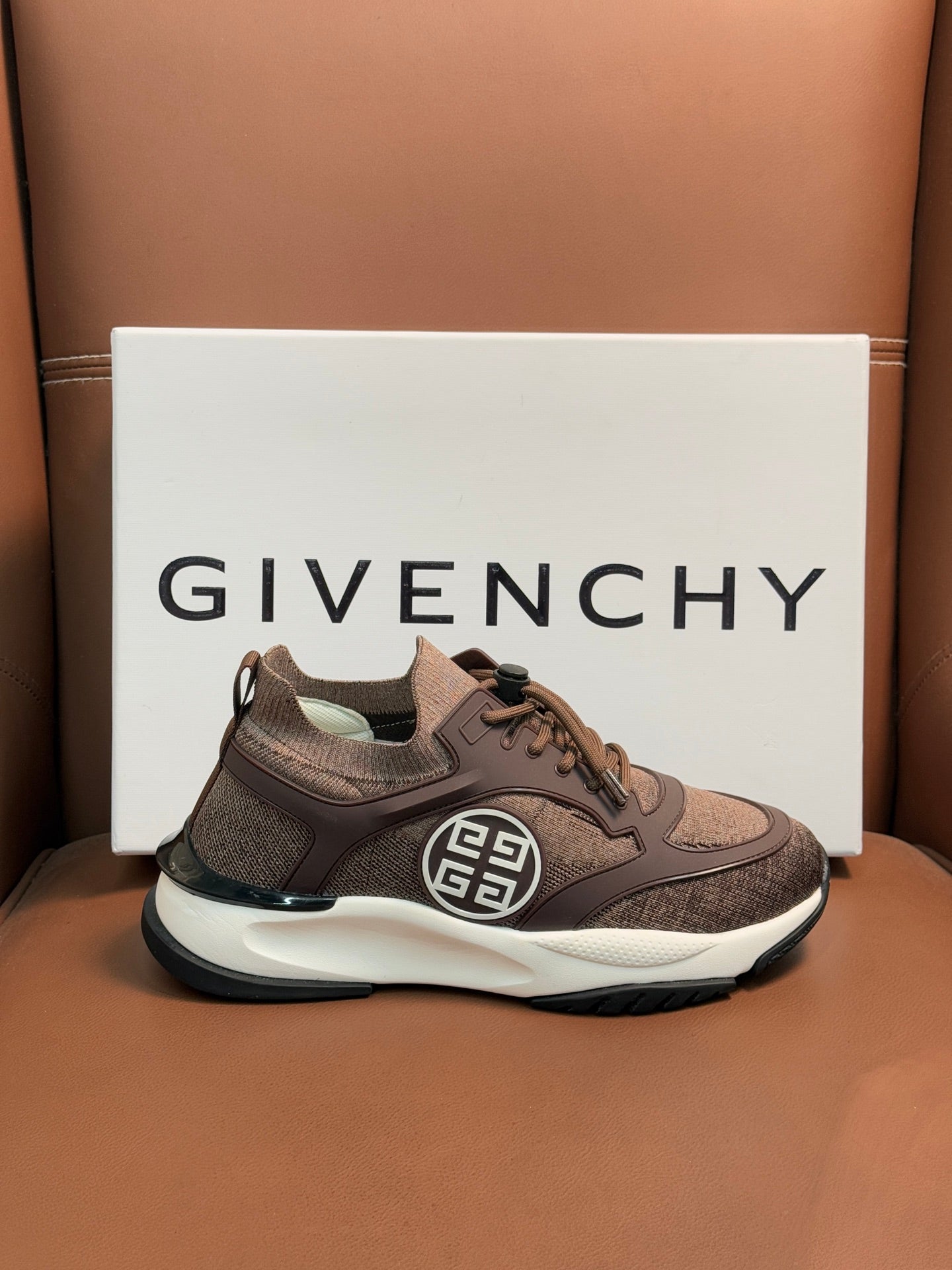 Brown Givenchy sneakers with lace-up, side emblem and black heel trim