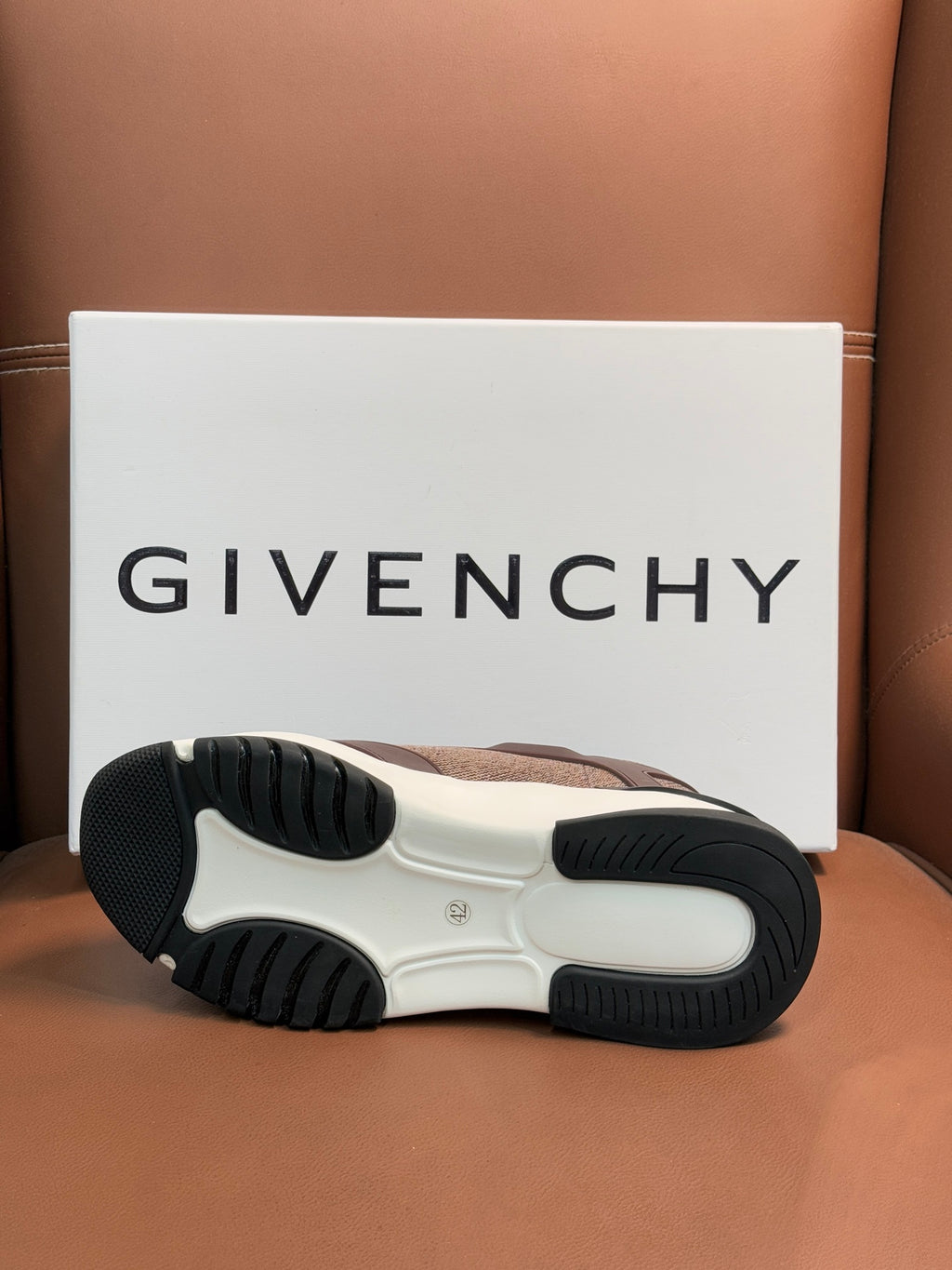 Givenchy sneaker outsole with textured tread on white and black rubber base