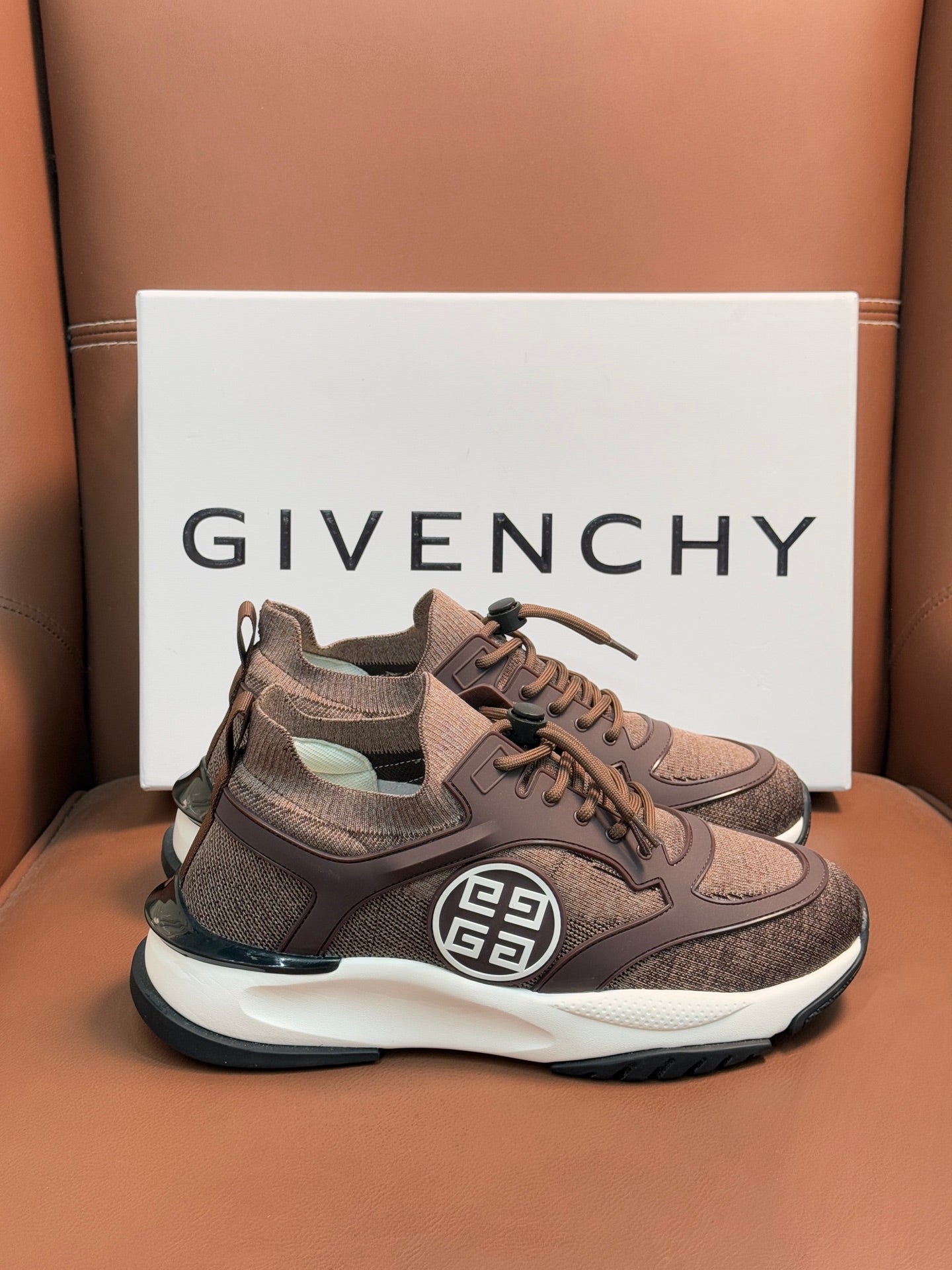 Brown Givenchy sneakers with lace-up, chunky white midsole and side logo