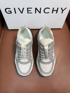Light gray lace-up sneakers with dark accents and logo on tongue.