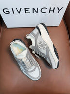 Light gray lace-up sneakers with black heel tab and circular side logo.
