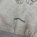 Grey hoodie hem with small logo patch