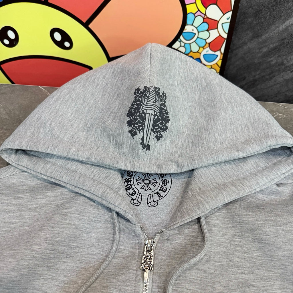 Grey hoodie with hood and centered black graphic, zip front visible