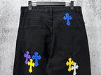 Black denim pants with cross patches on back pockets