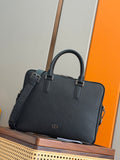 Dark leather handbag with double top handles and front flap pocket