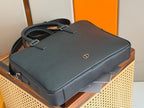 Dior men’s leather briefcase with structured top and side zipper pulls, dark