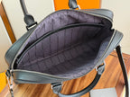Dior men’s bag interior view with lined pocket and zip closure, dark lining