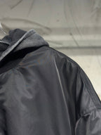 Long hooded jacket close-up, dark gray satin fabric and hood lining