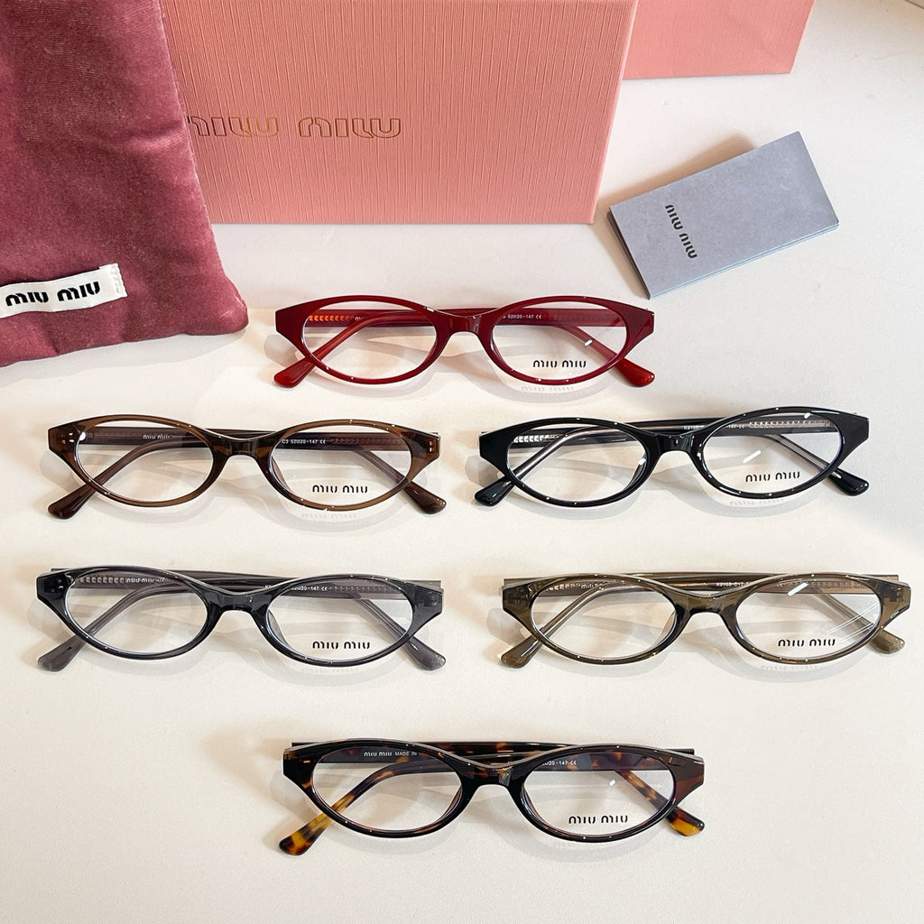 Assorted Miu Miu eyeglasses in red, black, and tortoise frames arranged in rows