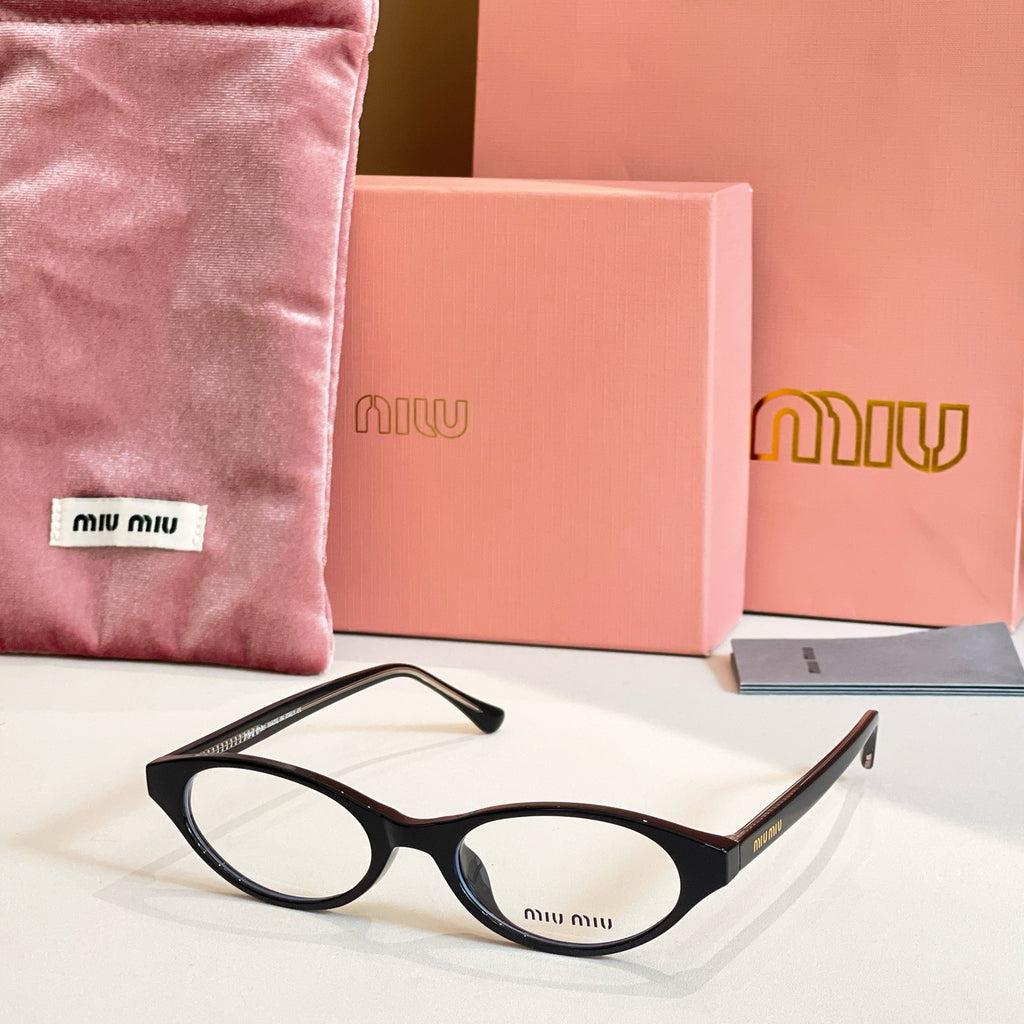 Miu Miu eyeglasses with black acetate frames and round clear lenses