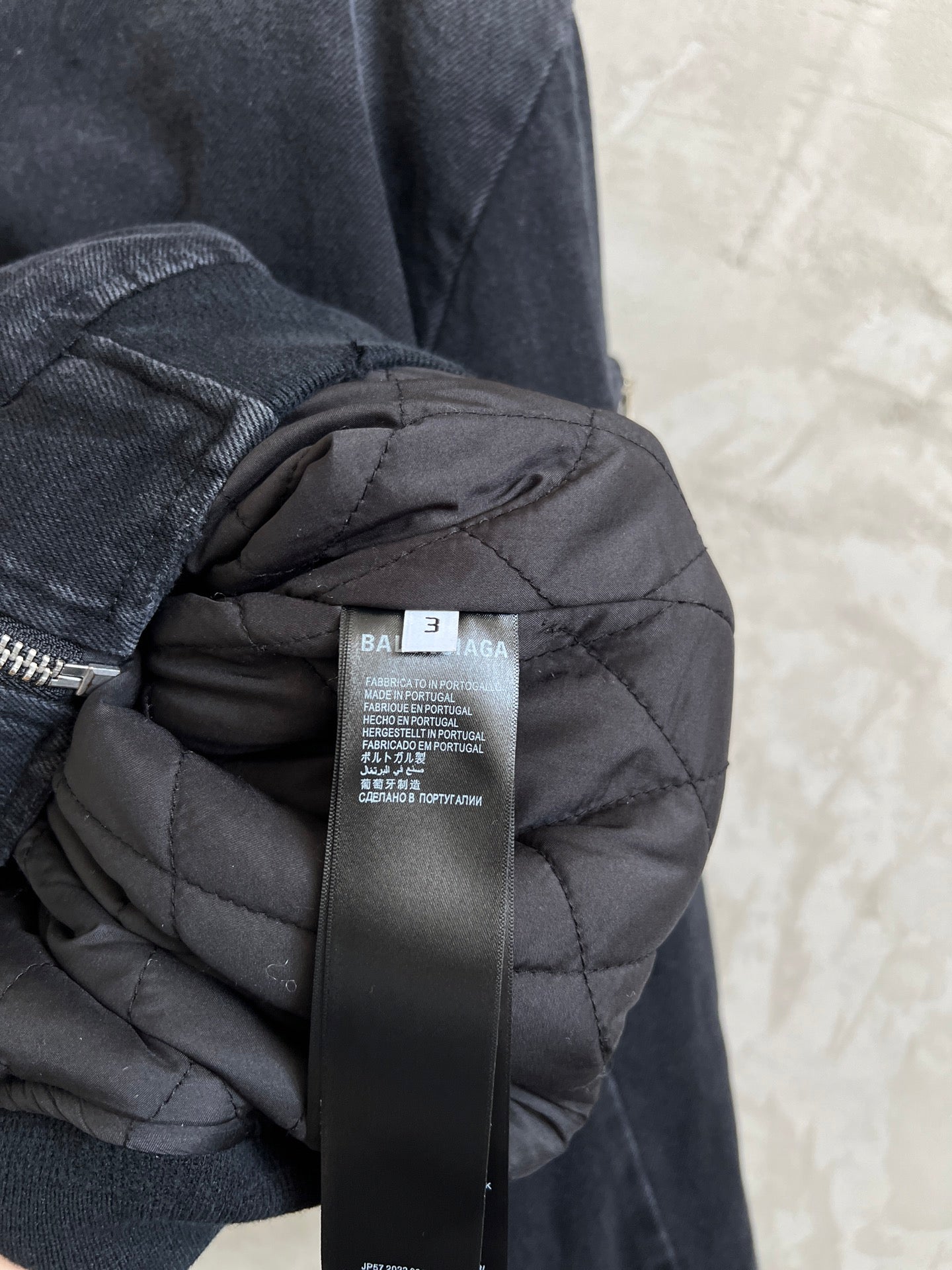 Balenciaga dark puffer-lined hood inside jacket, black care label on tag