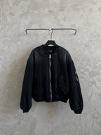 Balenciaga dark denim bomber jacket with zip front and ribbed cuffs