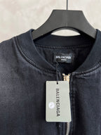 Balenciaga denim bomber jacket neckline with zipper and brand logo patch