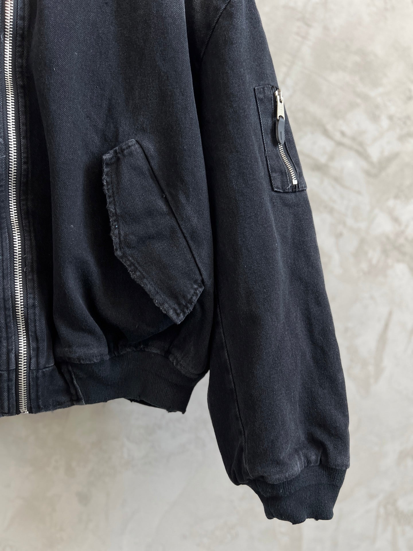 Balenciaga dark denim bomber jacket sleeve with chest zip pocket detail