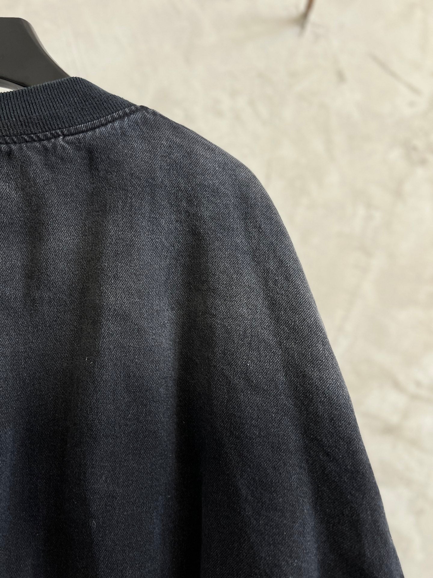 Balenciaga dark denim bomber jacket back with stitched seam across shoulders