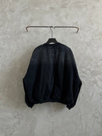 Balenciaga dark denim bomber jacket, back view, ribbed collar and hem