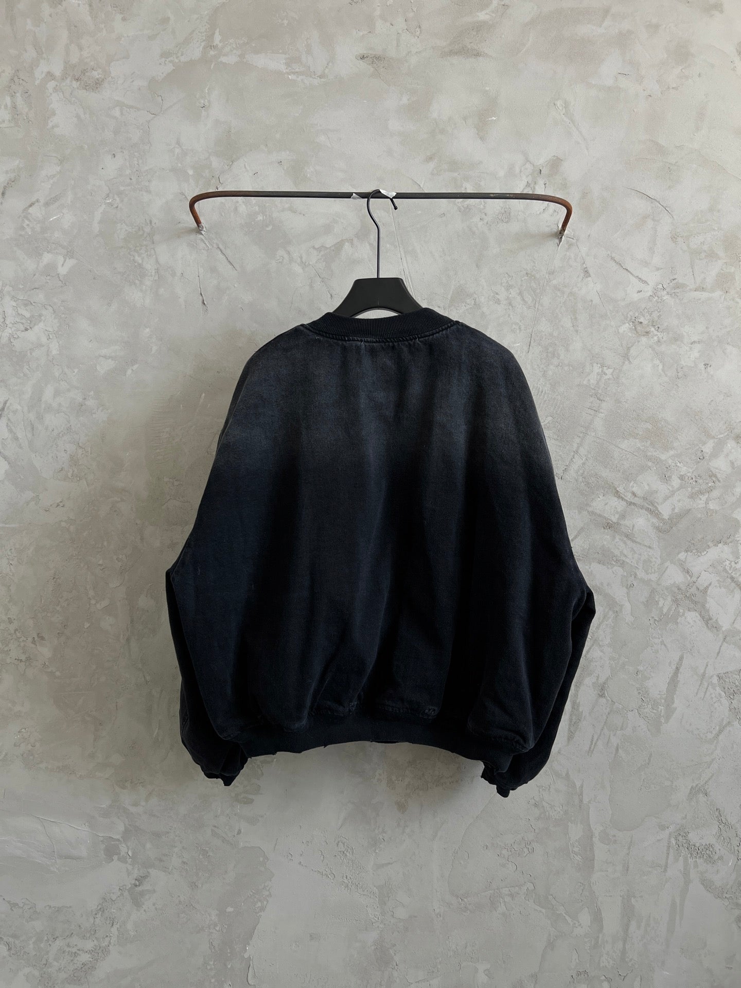 Balenciaga dark denim bomber jacket, back view, ribbed collar and hem
