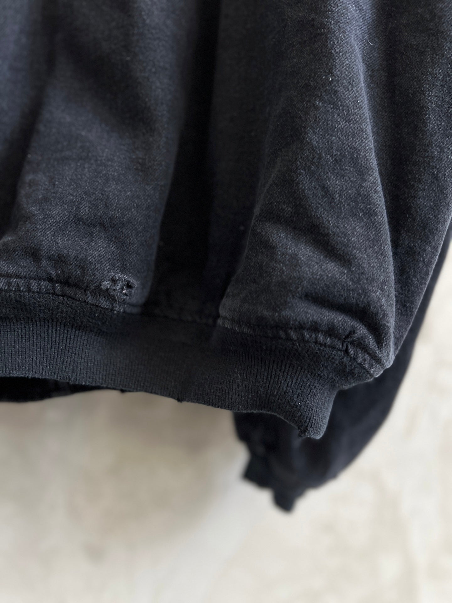 Balenciaga dark denim jacket lower cuff with ribbed knit trim and seam
