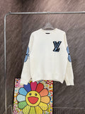 White long-sleeve knit sweatshirt with blue LV-style emblem and colorful sleeve graphics