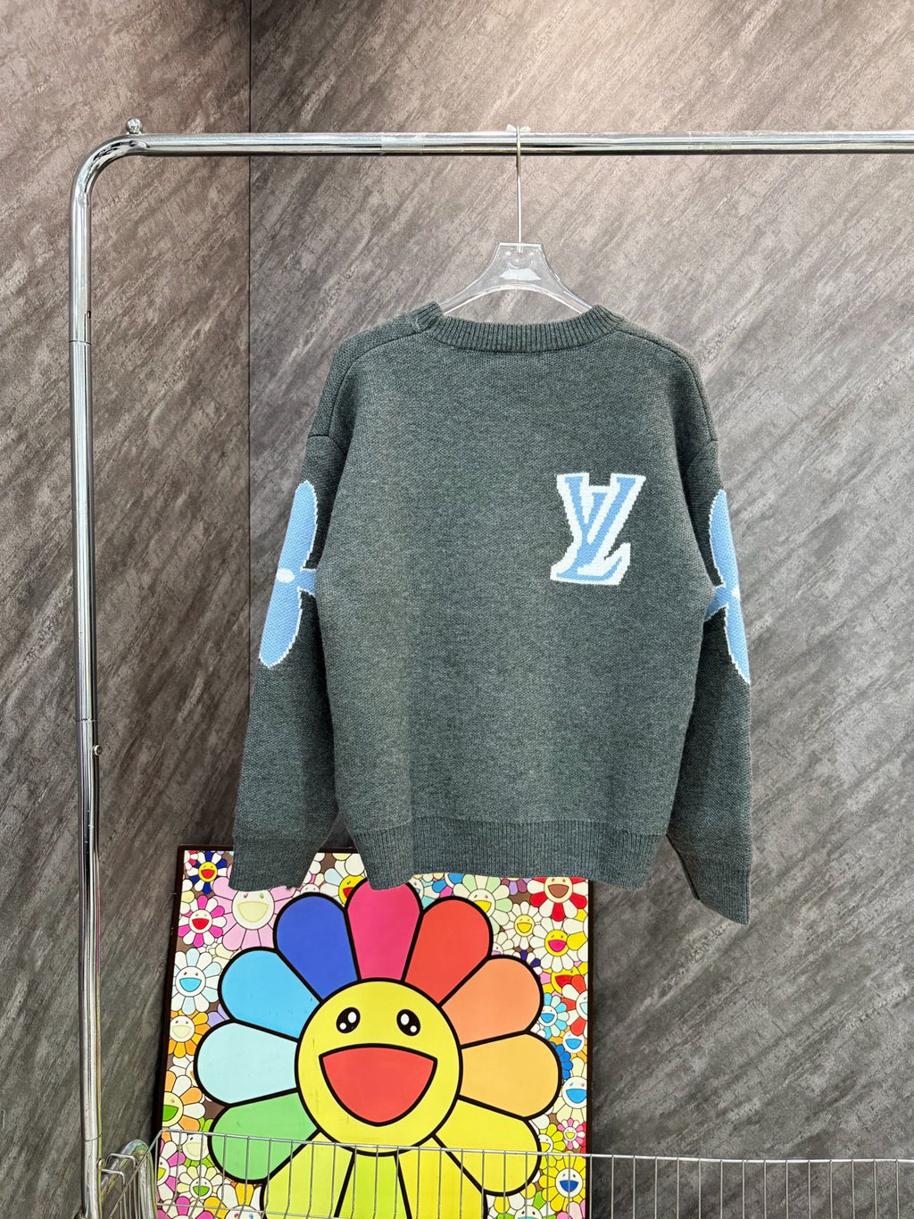Dark gray-green long-sleeve knit sweatshirt with blue LV-style emblem on back