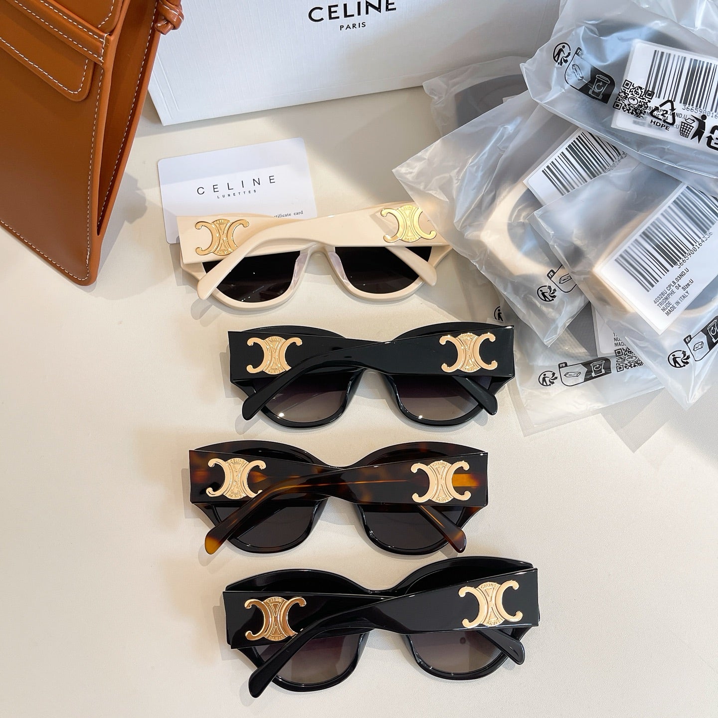 Celine sunglasses set with cream and black frames, gold decorative accents
