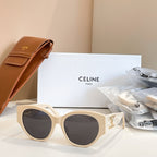 Celine sunglasses with cream frames and round lenses, gold logo detail